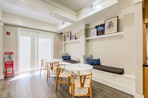 Peoria apartment for rent - A dining room with a white table and chairs.