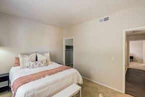 Aurora apartment for rent - a bedroom with a bed and a closet