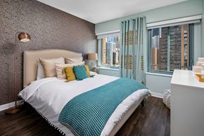 Chicago apartment for rent - a bedroom with a bed and two windows