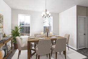Waldorf apartment for rent - A dining room with a table set for two and a chandelier hanging from the ceiling.