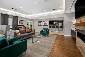 Arlington Heights apartment for rent - A living room with a green couch and a coffee table.