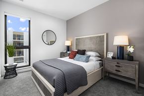 Oak Creek apartment for rent - a bedroom with a bed and a large window