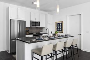 Oak Creek apartment for rent - a kitchen with a counter top and a stainless steel refrigerator