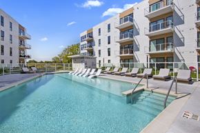 Oak Creek apartment for rent - A swimming pool in front of apartment buildings.