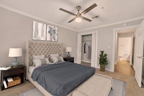 Decatur apartment for rent - A bedroom with a large bed and a ceiling fan.