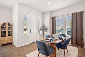 Mckinney apartment for rent - A dining room with a table set for four.