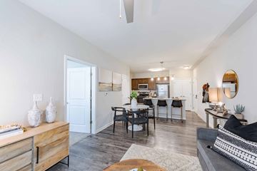 Roanoke apartment for rent - A modern living room with a grey sofa and a wooden coffee table.