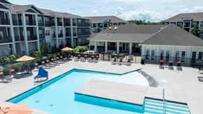 Roanoke apartment for rent - A large swimming pool in front of apartment buildings.