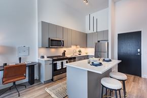 Naperville apartment for rent - a kitchen and dining area in a 555 waverly unit