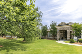 Knightdale apartment for rent - A building with a green lawn in front of it.