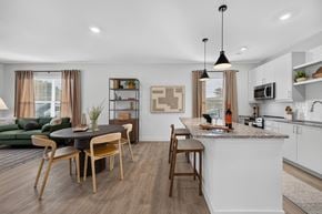 Waltham apartment for rent - A modern kitchen with a dining table and chairs.