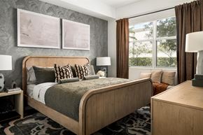Miami apartment for rent - A bedroom with a large bed and two lamps.