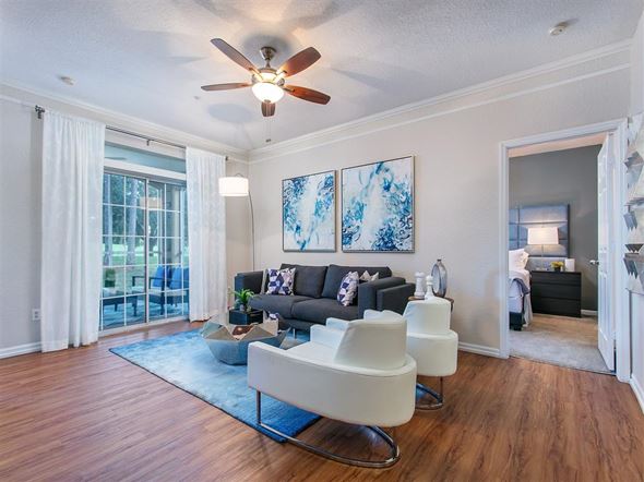 Orlando apartment for rent - a living room with a couch and a ceiling fan