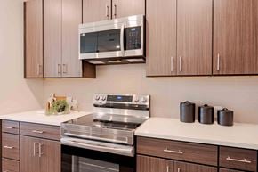 Westfield apartment for rent - A modern kitchen with a stainless steel stove and microwave above it.