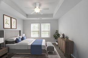 Savannah apartment for rent - A bedroom with a bed, a bench, and a ceiling fan.