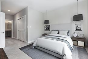 Salem apartment for rent - A bedroom with a large bed and a nightstand with a clock on it.