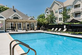 Salem apartment for rent - A pool with a metal railing and a black umbrella.