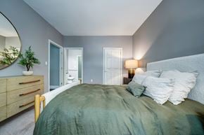 Salem apartment for rent - A bedroom with a bed, dresser, and mirror.