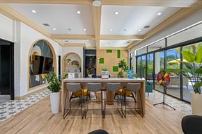 Oakland Park apartment for rent - a dining room with a table and chairs in front of a window