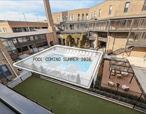 Chicago apartment for rent - A pool is being built in a courtyard surrounded by buildings.