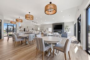 Lee's Summit apartment for rent - A modern dining room with a large table and chairs.