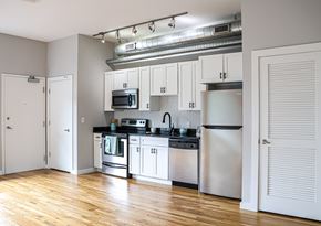Nashville apartment for rent - A kitchen with white cabinets and stainless steel appliances.