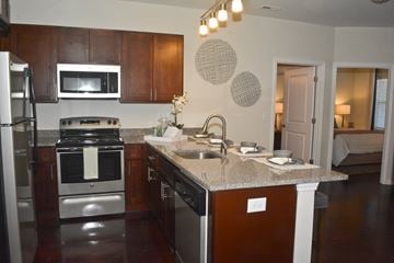 Wilmington apartment for rent - A kitchen with a stove top oven and a microwave.
