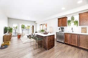 Arlington apartment for rent - A kitchen with wooden cabinets and a large island.