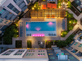 Richardson apartment for rent - A swimming pool with a pink light in the middle of it.