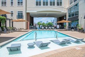Charlotte apartment for rent - A pool with a red and white sign on the ground.