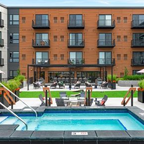 Minneapolis apartment for rent - a swimming pool in front of a hotel with a pool