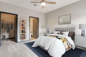 Pensacola apartment for rent - A bedroom with a large bed and a ceiling fan.