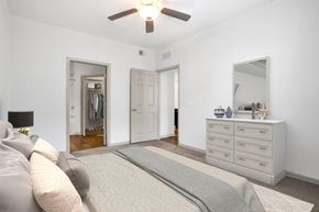 Estero apartment for rent - a bedroom with a large bed and a ceiling fan