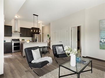 Robbinsdale apartment for rent - a living room and kitchen with a table and chairs