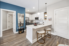 Charleston apartment for rent - A kitchen with a white counter and bar stools.