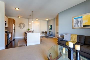 Medford apartment for rent - A living room with a couch, a coffee table, and a painting on the wall.