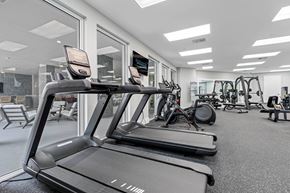 Boyton Beach apartment for rent - A treadmill is in the foreground of a well-equipped gym.