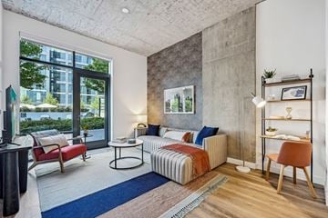 Chicago apartment for rent - a living room with a couch and a large window