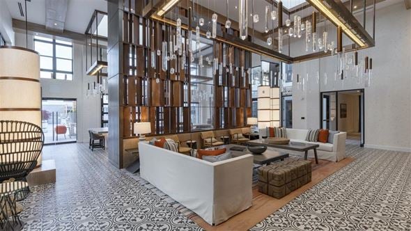 Charlotte apartment for rent - a lobby with couches and chairs and a chandelier