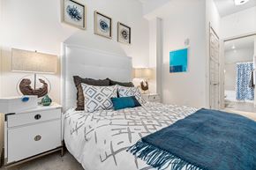 Ft Lauderdale apartment for rent - a bedroom with a white bed and a blue blanket
