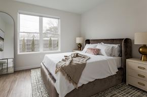 West Roxbury apartment for rent - a bedroom with a large bed and a large window