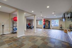 St. Louis Park apartment for rent - A spacious room with a tiled floor and a balloon on the left.