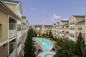 Laurel apartment for rent - an apartment building with a large swimming pool