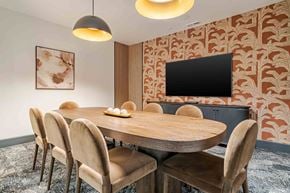 Canton apartment for rent - A modern dining room with a wooden table and chairs.