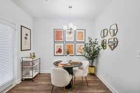 Sandy Springs apartment for rent - a dining room with a table and chairs and a chandelier