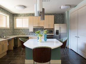 Dallas apartment for rent - A kitchen with a table and chairs in the middle.