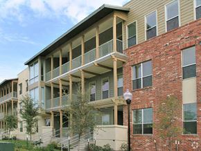 San Antonio apartment for rent - a brick building with balconies and a street light