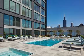 Chicago apartment for rent - Sparkling Pool Deck with Lounge Chairs at Landmark West Loop Apartments in Chicago, IL