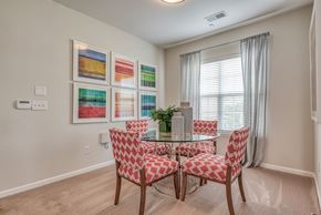 Spartanburg apartment for rent - A dining room with a table and chairs.