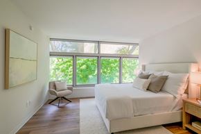 Danbury apartment for rent - a bedroom with a bed and a large window